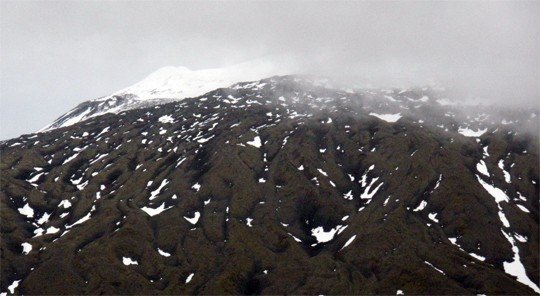 We glimpsed that glacier, and it didn't look pleased with us, staring down over the lava flow.