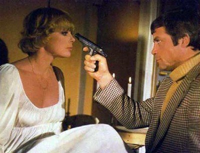 Oliver Reed points the pistol of guilt at Elke Sommer in the 1974 film adaptation.